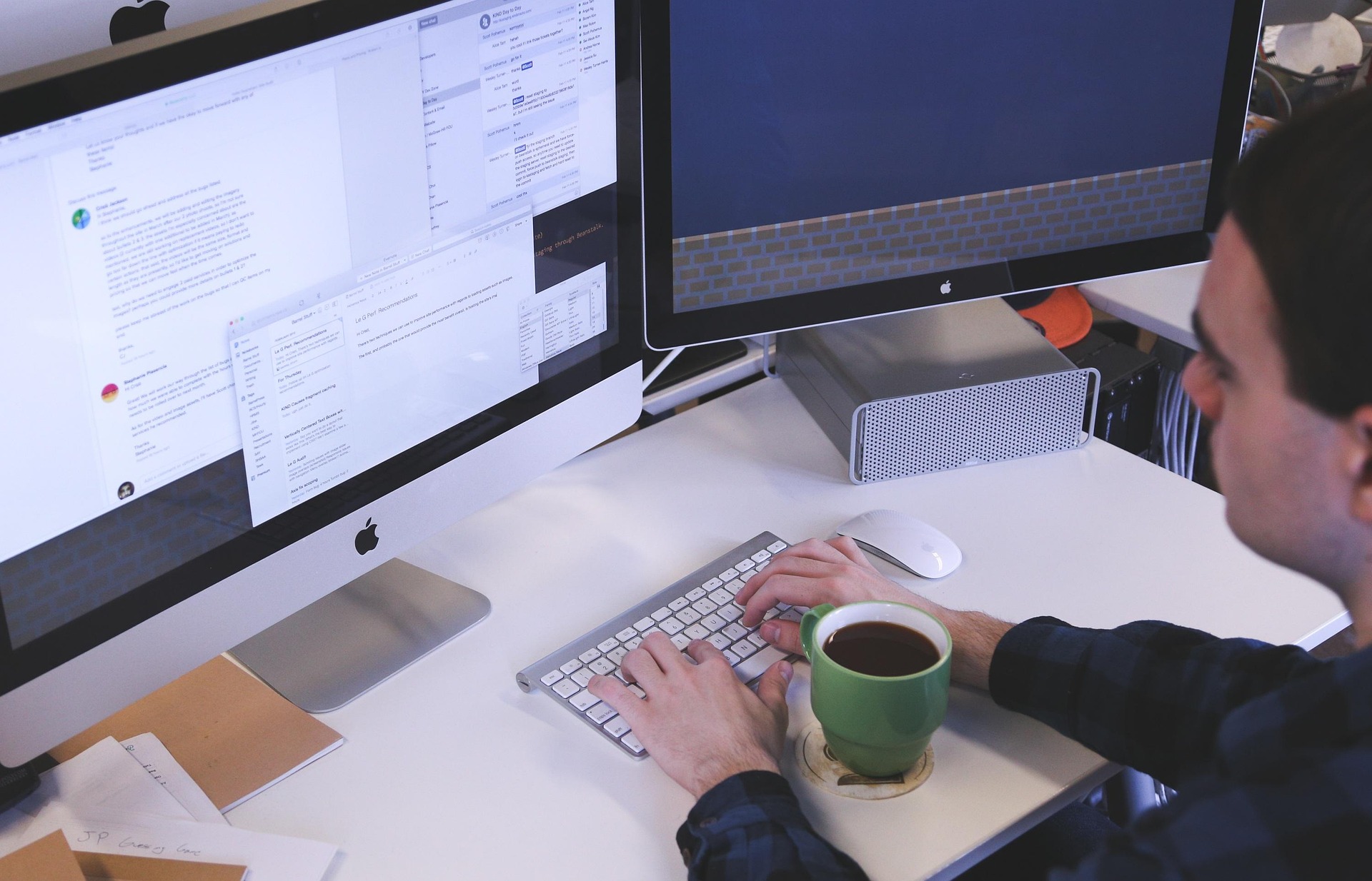 Man working on a laptop in a modern office setting